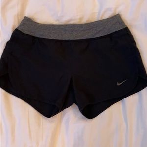 Black Nike running shorts